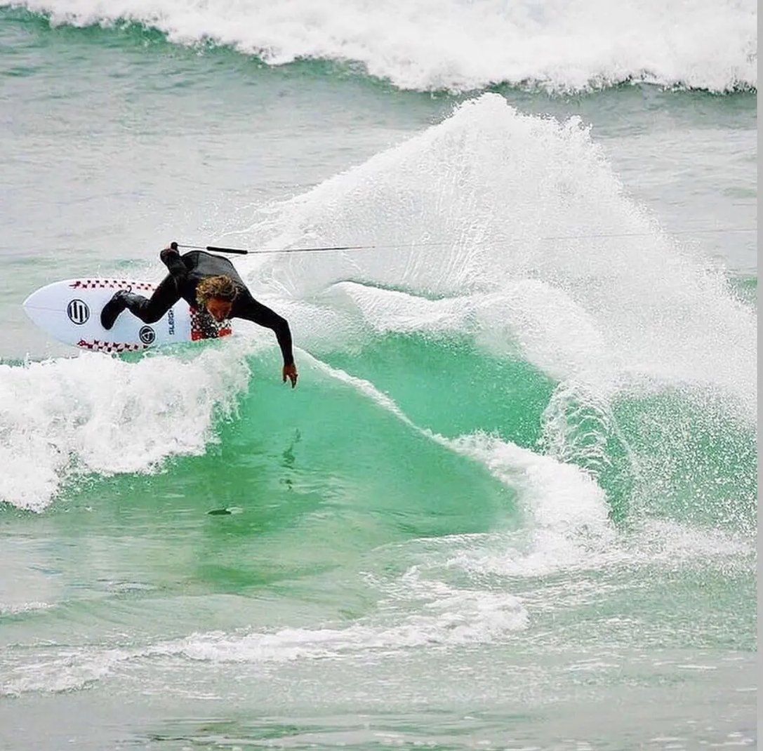 Josh Sleigh performing an aerial surf maneuver using Motowinch